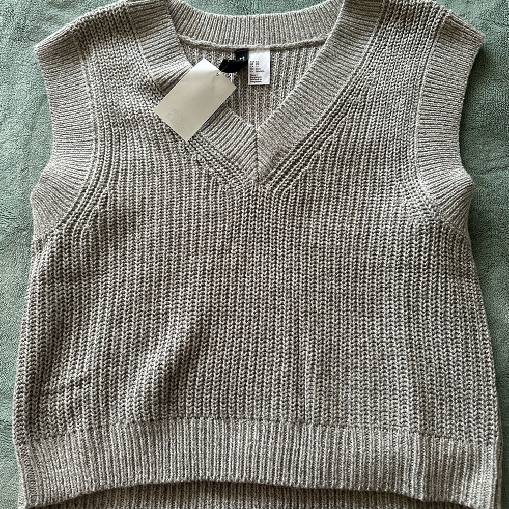 grey sweater vest